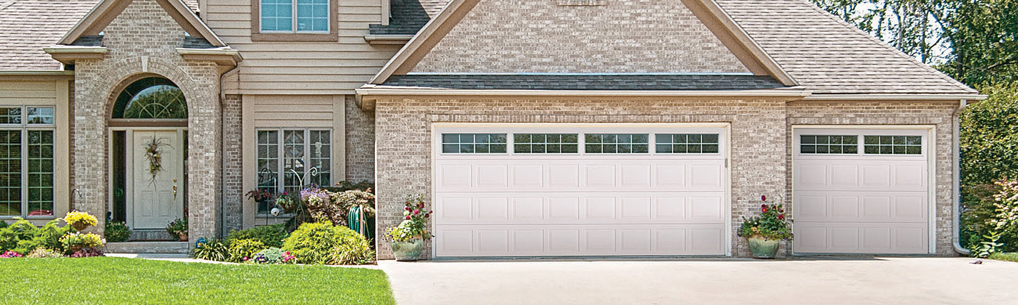 House with 2 garage doors.