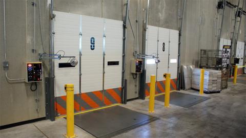 Bollards protecting garage doors in a receving area.