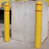 Bollards around a concrete pillar.